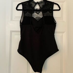 Sexy one piece bodysuit black with lace. Back keyhole cut out.